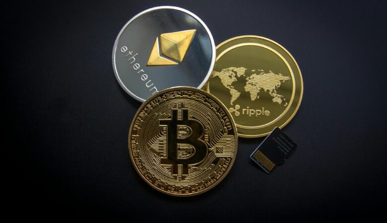 A striking image of Bitcoin, Ethereum, and Ripple coins illustrating modern digital currency.